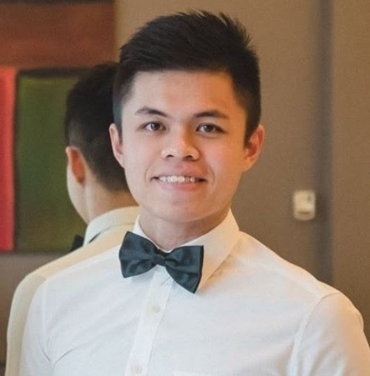 Portrait of Wei-Lip Teo wearing a white shirt and bow tie